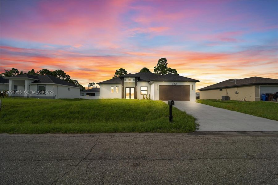 Front exterior of a new home in , Lehigh Acres, FL, highlighting curb appeal (Image 1). Front exterior of a new home in , Lehigh Acres, FL, highlighting curb appeal (Image 1).