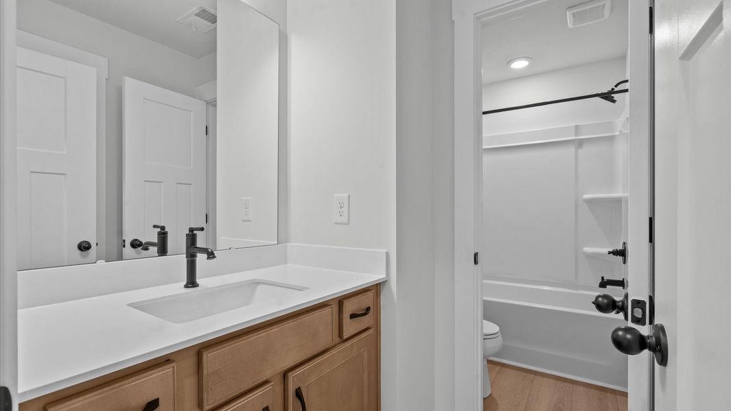 Stylish guest bathroom with superior design and thoughtful storage solutions