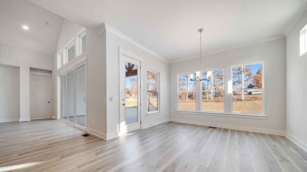 Open Dining area with large amount of natural light near the kitchen