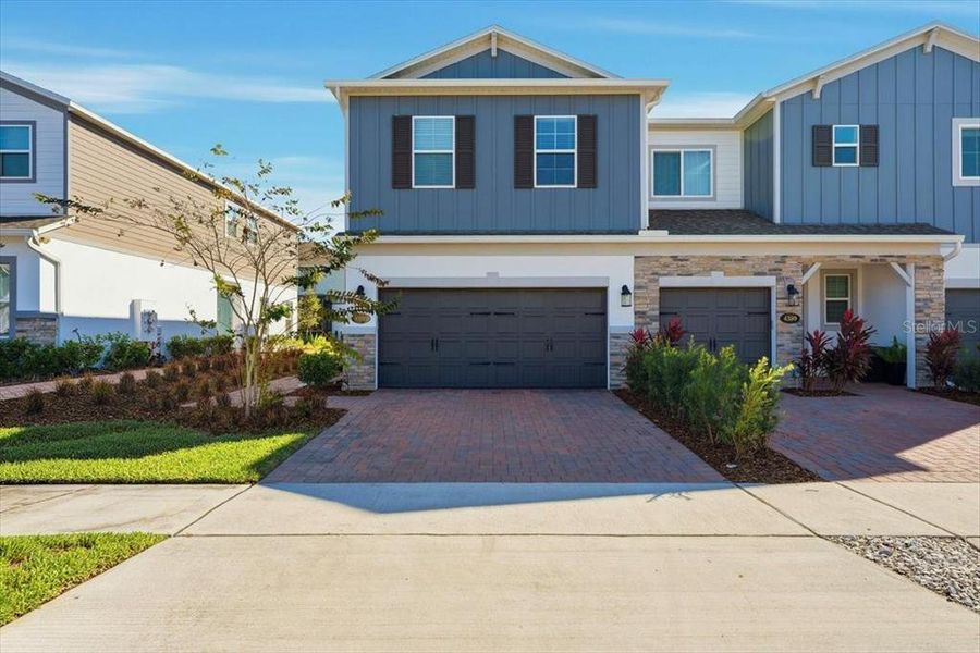 Front exterior of a new home in , Orlando, FL, highlighting curb appeal (Image 1). Front exterior of a new home in , Orlando, FL, highlighting curb appeal (Image 1).