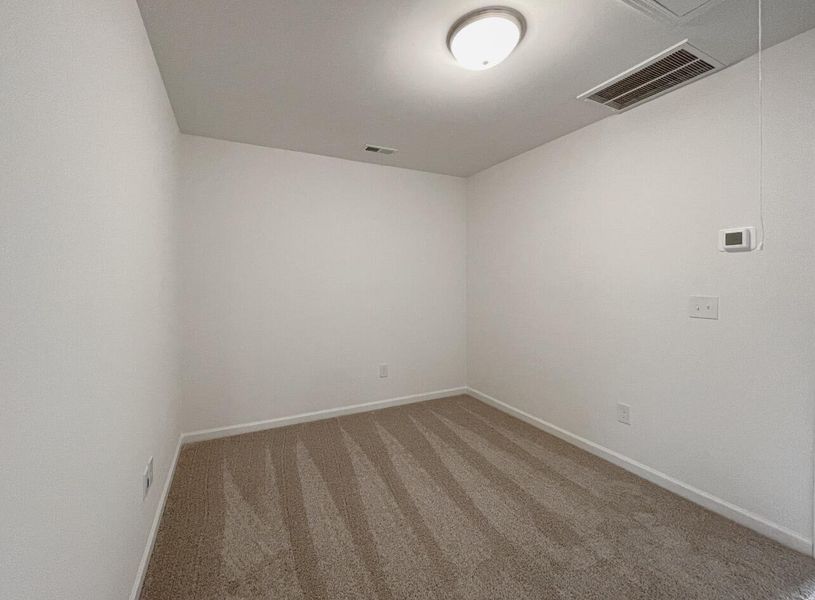 Spacious, unfurnished interior of a new home in East Main Townes, Spartanburg (Image 17).