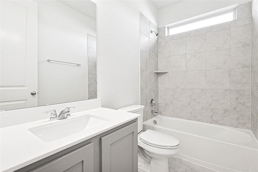 Full bath featuring vanity and shower / tub combination Full bath featuring vanity and shower / tub combination