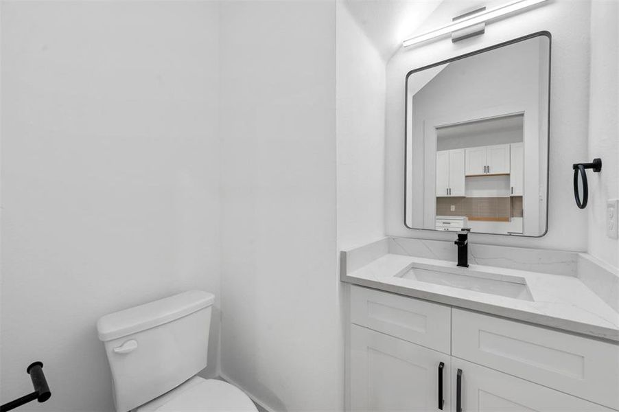 Bathroom with vanity and toilet