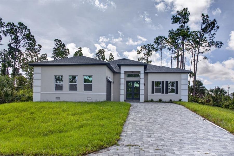 Front exterior of a new home in , Port Charlotte, FL, highlighting curb appeal (Image 26).