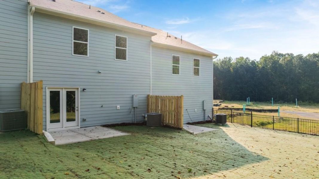 Exterior details and patio area of a home in Waypoint, Flowery Branch (Image 20).