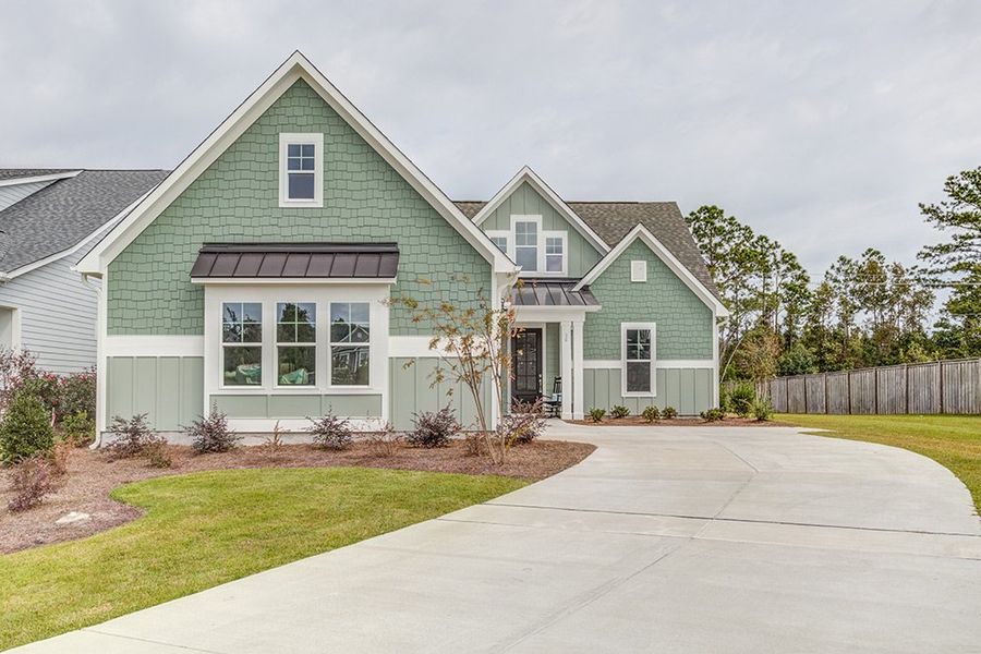 Representative exterior photo of a completed home built from the The Amherst by RobuckHomes in Windwater, Hampstead, NC (Image 28).