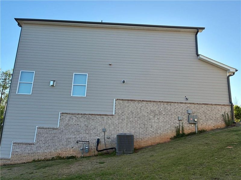 Exterior details and patio area of a home in Hamilton Crossing, Buford (Image 13).