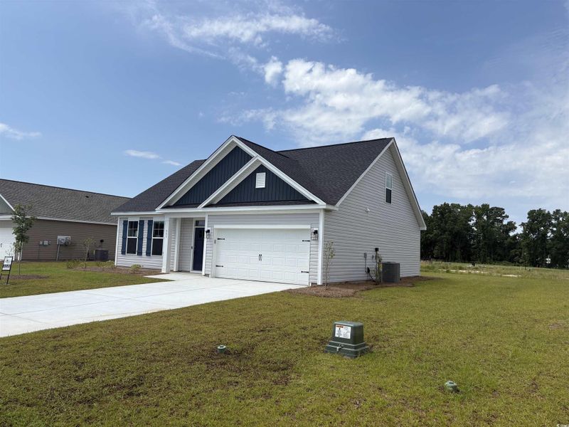 Front exterior of a new home in Briarfield, Conway, SC, highlighting curb appeal (Image 2). Front exterior of a new home in Briarfield, Conway, SC, highlighting curb appeal (Image 2).