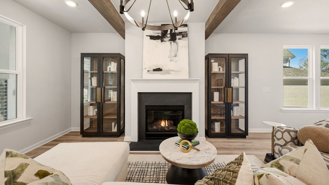 Gathering room with accent ceiling, fireplace, and windows Gathering room with accent ceiling, fireplace, and windows