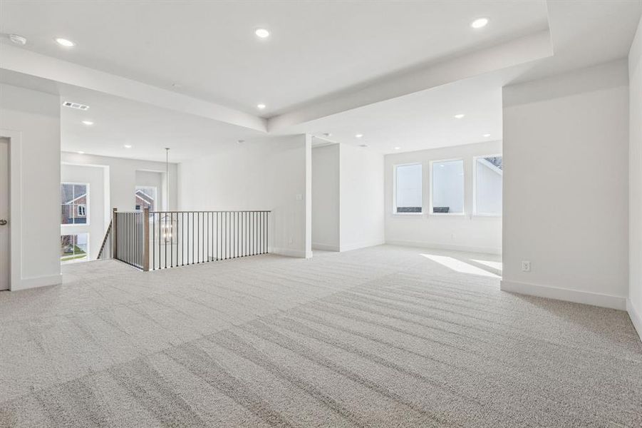 This spacious game room offers plenty of space to host those big game day parties!