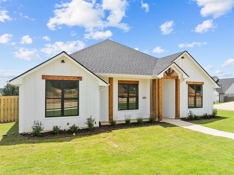 Front exterior of a new home in , Lindale, TX, highlighting curb appeal (Image 21).