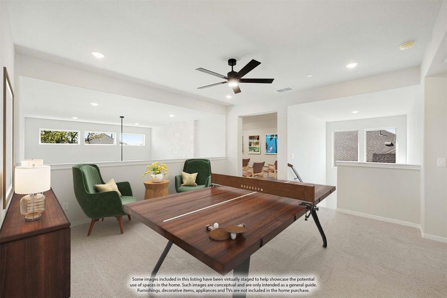 Game room with ping pong table, green accent chairs, ceiling fan, and carpet flooring Game room with ping pong table, green accent chairs, ceiling fan, and carpet flooring