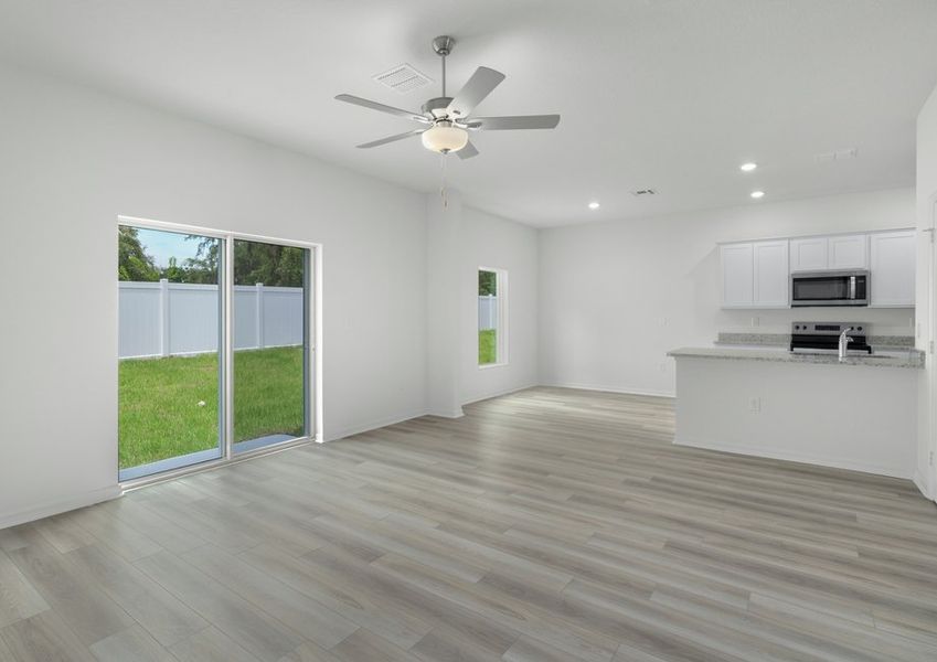 Sliding door in the family room lead to the back yard