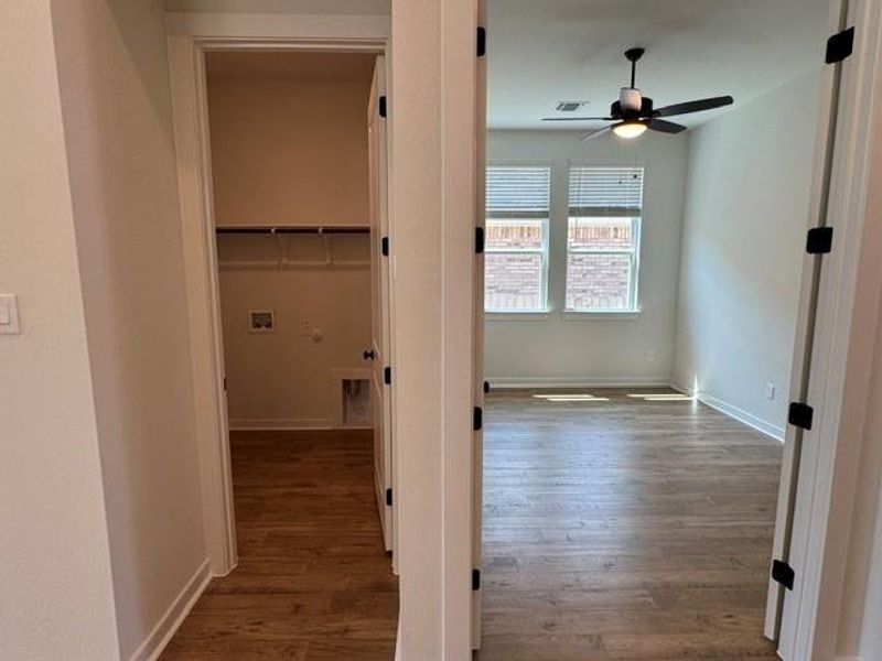 Hardwood floors and generous natural light create an inviting atmosphere in this versatile room.