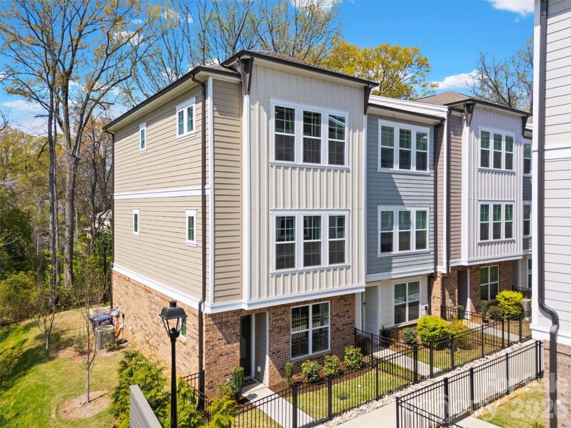 Corner lot, end-unit backing to trees!