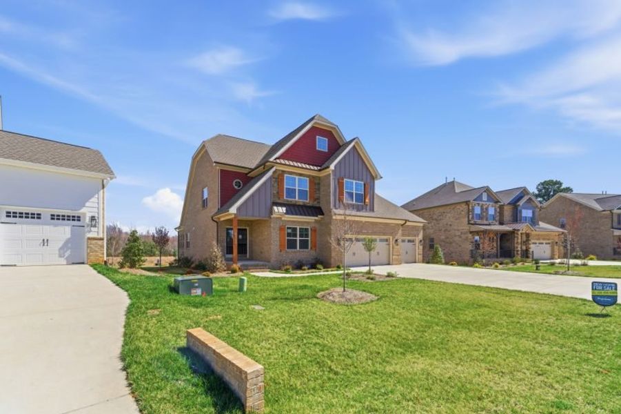 Representative exterior photo of a completed home built from the Hampton by Keystone Homes NC in Preserve at Carriage Cove, Oak Ridge, NC (Image 42).