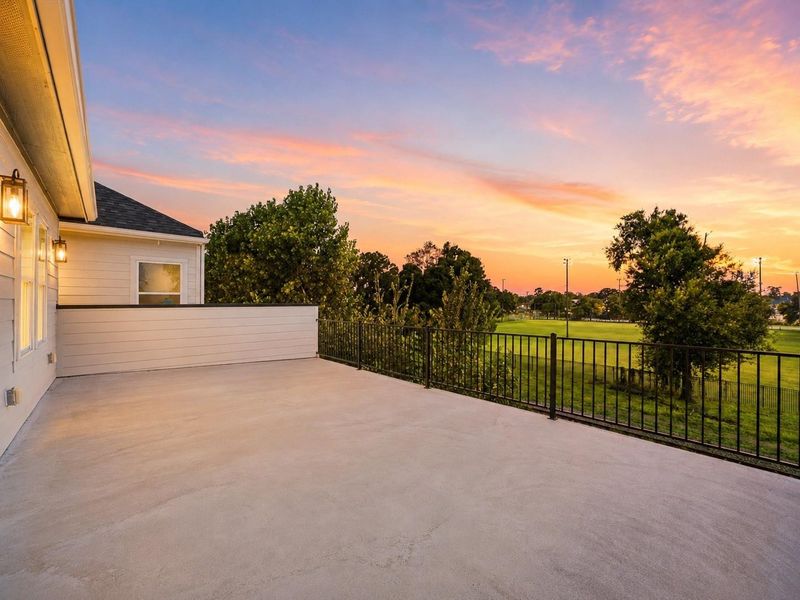 Oversized balcony overlooking open green space, ideal for gatherings, relaxing, and hosting guests Oversized balcony overlooking open green space, ideal for gatherings, relaxing, and hosting guests