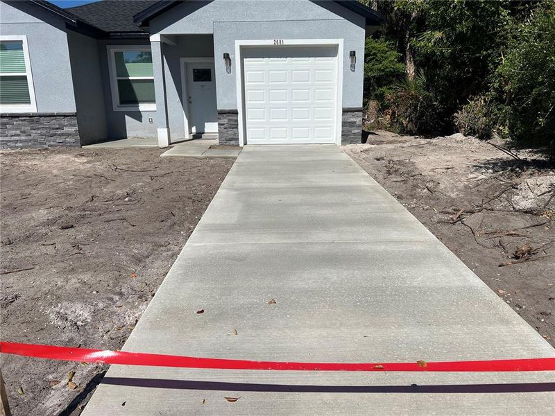 Front exterior of a new home in , Sanford, FL, highlighting curb appeal (Image 18). Front exterior of a new home in , Sanford, FL, highlighting curb appeal (Image 18).
