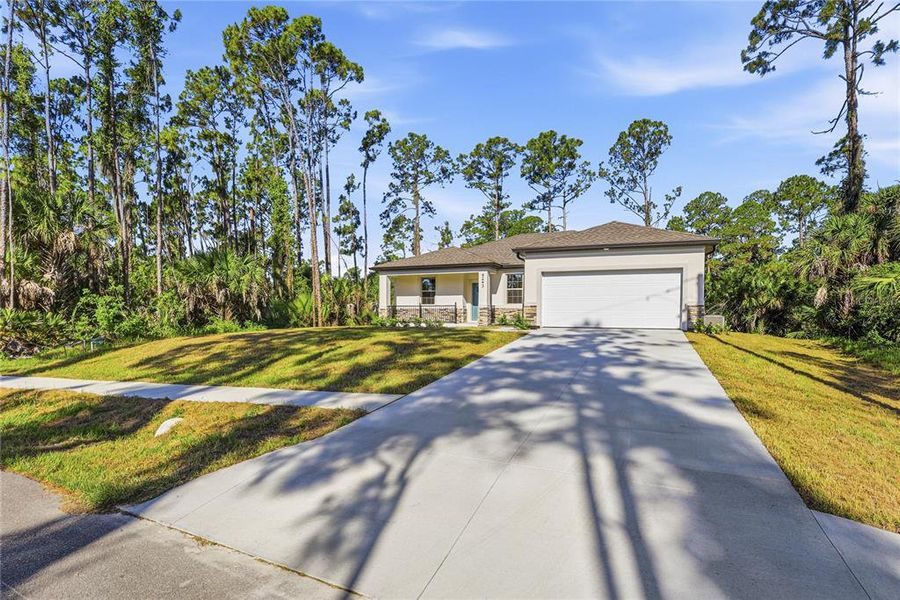 Front exterior of a new home in , North Port, FL, highlighting curb appeal (Image 15).