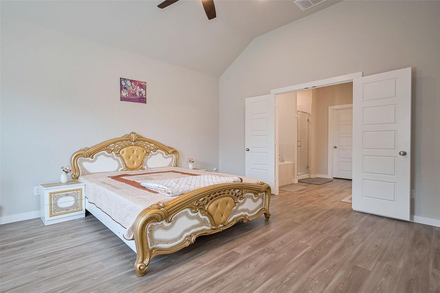 Guest bedroom with large window.