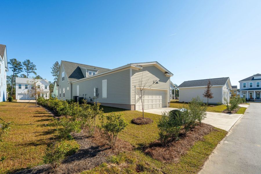 Front exterior of a new home in Nexton, Summerville, SC, highlighting curb appeal (Image 14). Front exterior of a new home in Nexton, Summerville, SC, highlighting curb appeal (Image 14).