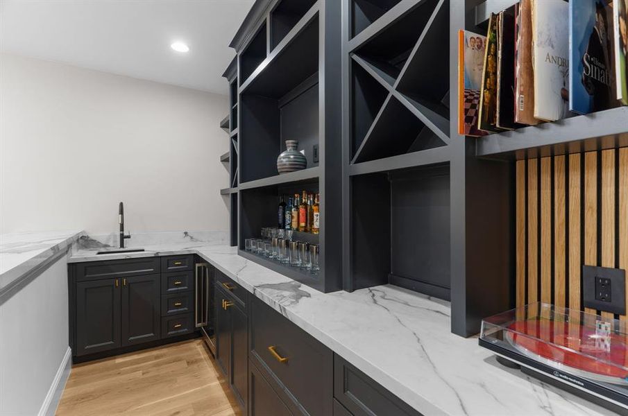 Game room bar with sink and wine fridge. Game room bar with sink and wine fridge.
