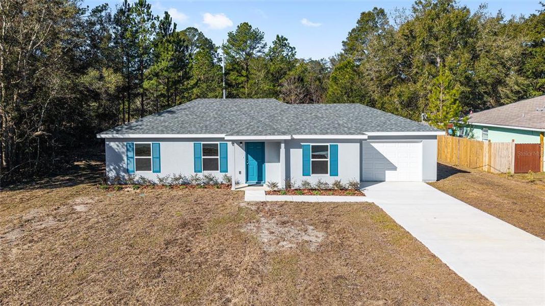 Front exterior of a new home in , Ocala, FL, highlighting curb appeal (Image 17).
