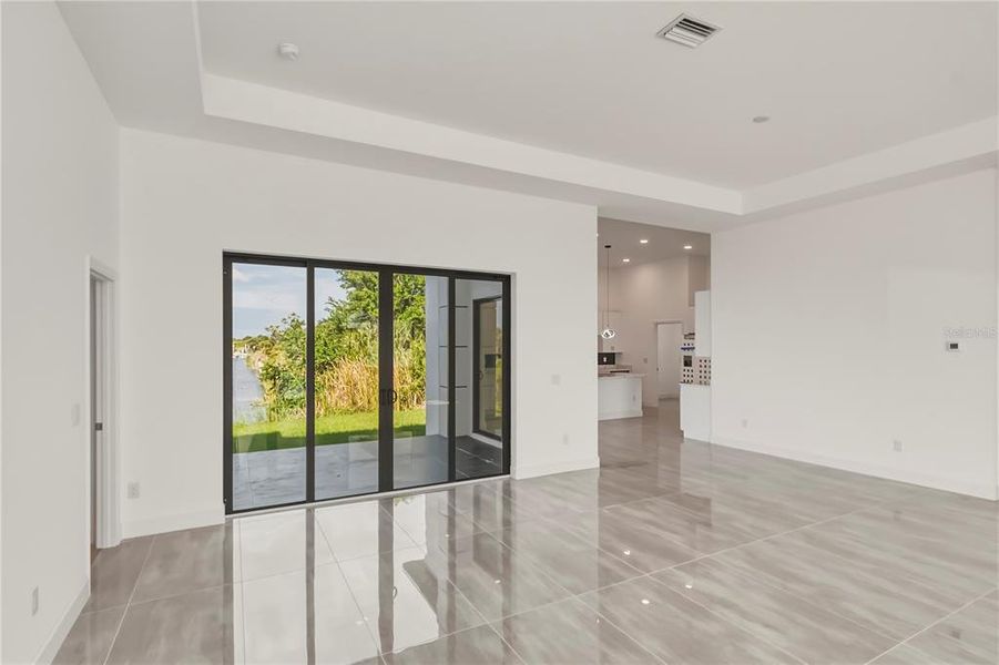 Spacious, unfurnished interior of a new home in , Port Charlotte (Image 59).