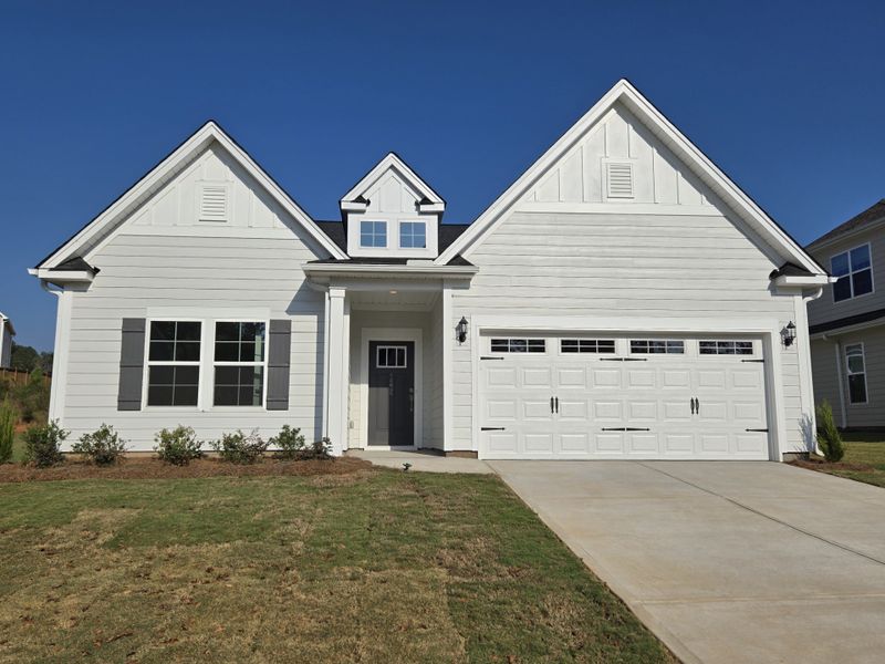 Front exterior of a new home in Cottages at Lake Emory, Inman, SC, highlighting curb appeal (Image 1).