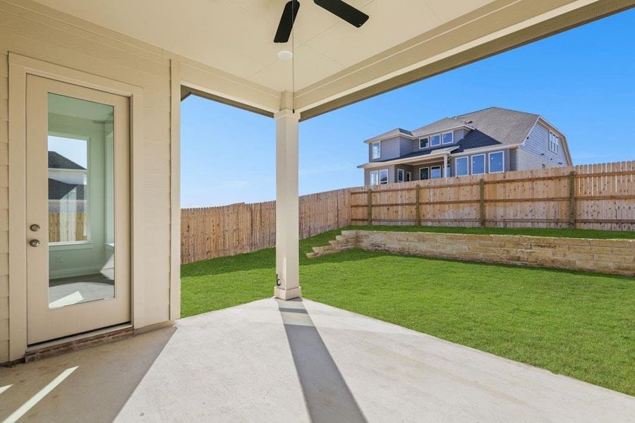 Fenced backyard with a patio area and a ceiling fan Fenced backyard with a patio area and a ceiling fan