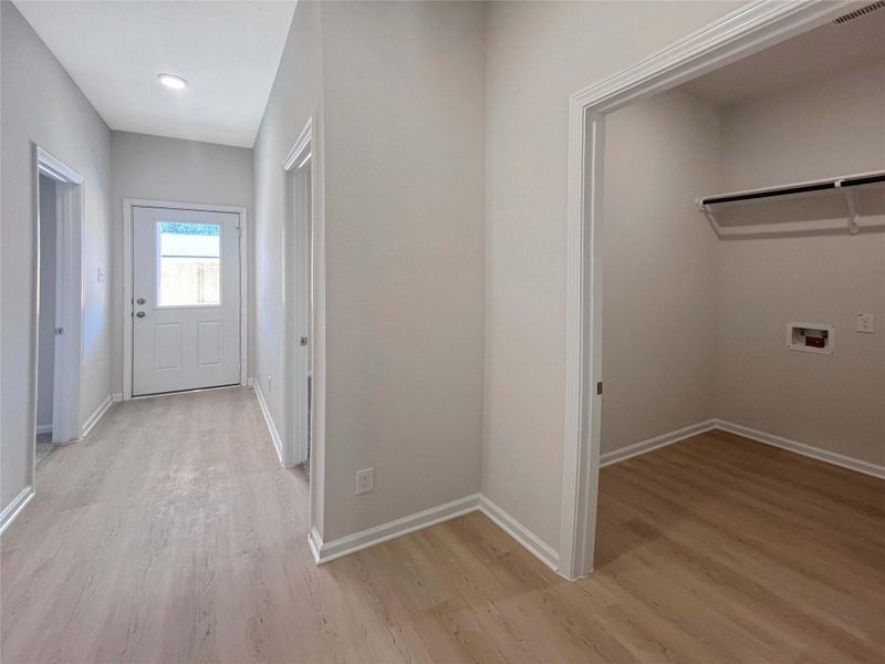 Hallway and Utility Room. Home under construction. Sample floor plan photo used for illustrative purposes only. Upgrades, selections options, windows and colors may vary.