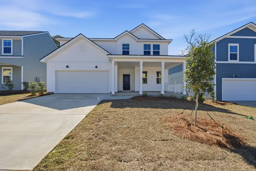 Front exterior of a new home in Grand Arbor, Blythewood, SC, highlighting curb appeal (Image 1). Front exterior of a new home in Grand Arbor, Blythewood, SC, highlighting curb appeal (Image 1).
