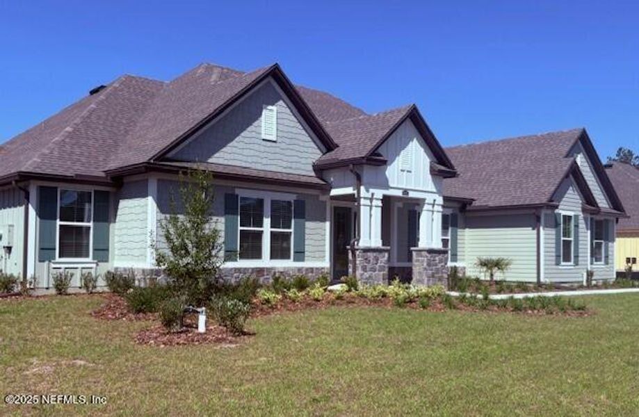Front exterior of a new home in , Hilliard, FL, highlighting curb appeal (Image 13).
