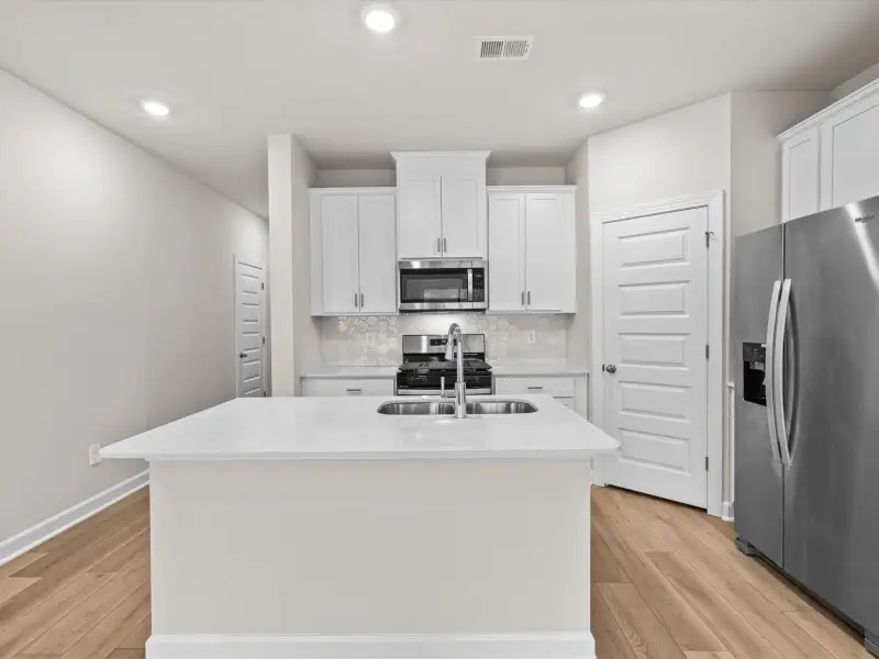 Furnished interior view inside a new home in Crossing at Abner Creek Townes, Greer (Image 3).