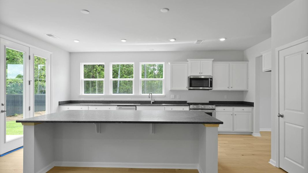 Representative furnished interior of a home built from the FORRESTER by D.R. Horton in Founders Corner, Summerville (Image 3).