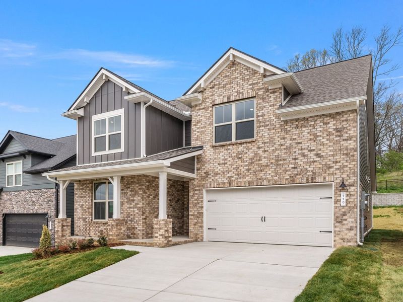 Front exterior of a new home in Woods Crossing, Gallatin, TN, highlighting curb appeal (Image 28).