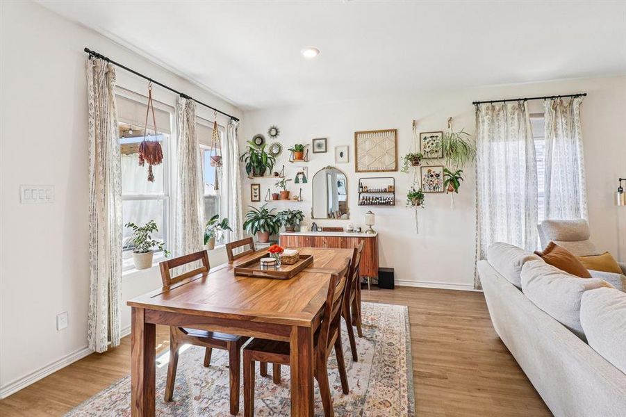 Dining space with light wood-type flooring and recessed lighting Dining space with light wood-type flooring and recessed lighting