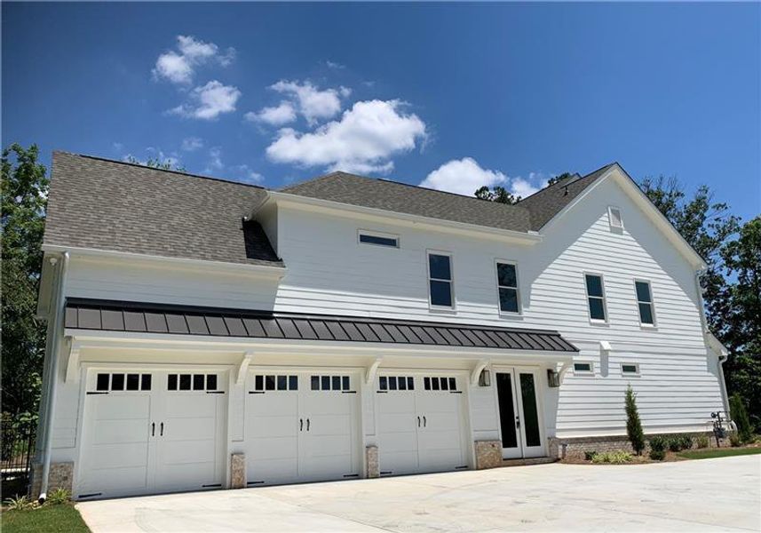 Front exterior of a new home in , Marietta, GA, highlighting curb appeal (Image 30).
