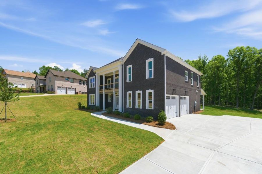 Front exterior of a new home in , Griffin, GA, highlighting curb appeal (Image 31).