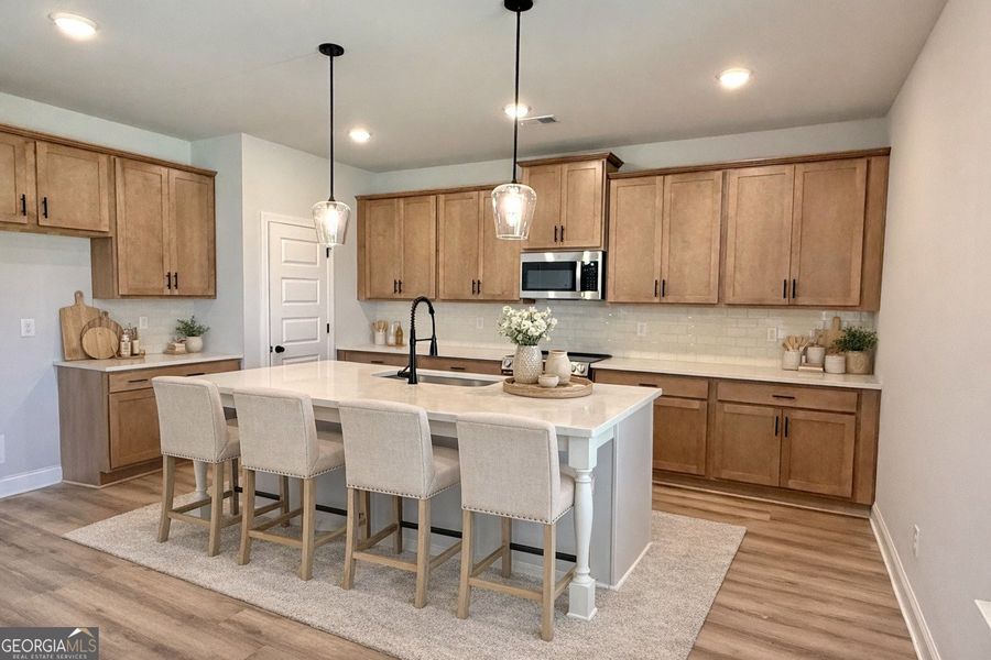 Furnished interior view inside a new home in Stone Brooke, Gray (Image 7).