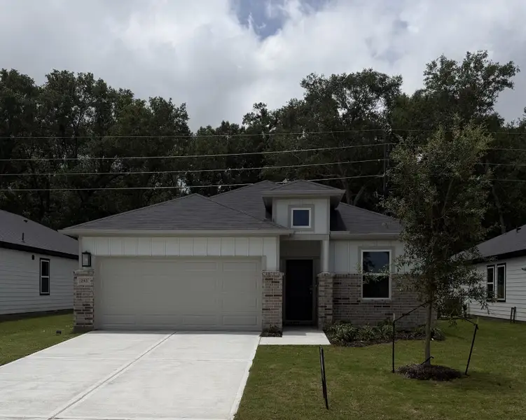 Front exterior of a new home in Newport Grove 50s, Crosby, TX, highlighting curb appeal (Image 1). Front exterior of a new home in Newport Grove 50s, Crosby, TX, highlighting curb appeal (Image 1).