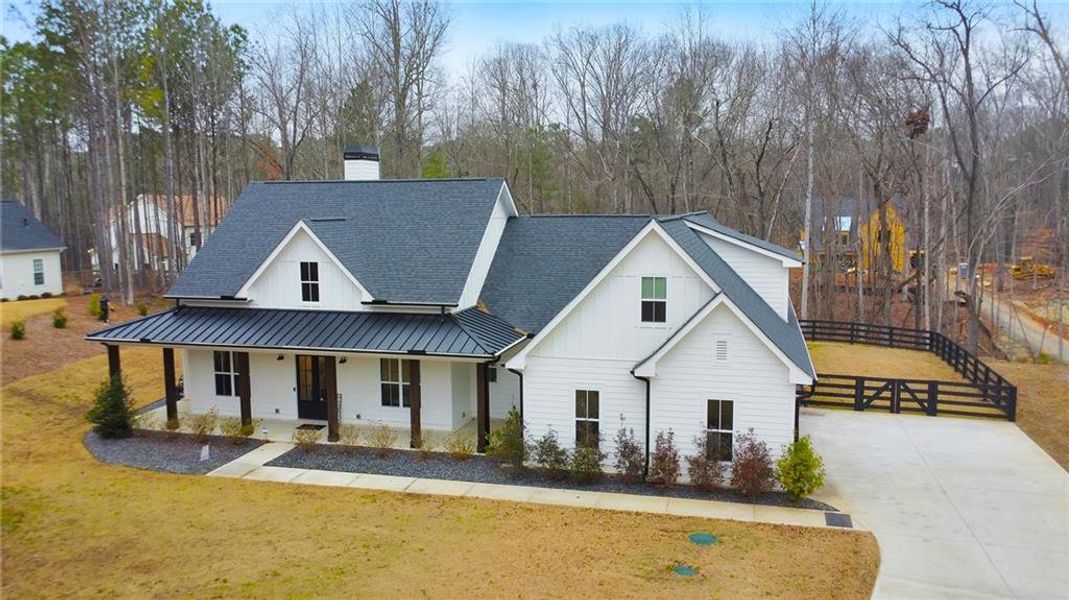 Front exterior of a new home in , Woodstock, GA, highlighting curb appeal (Image 22).