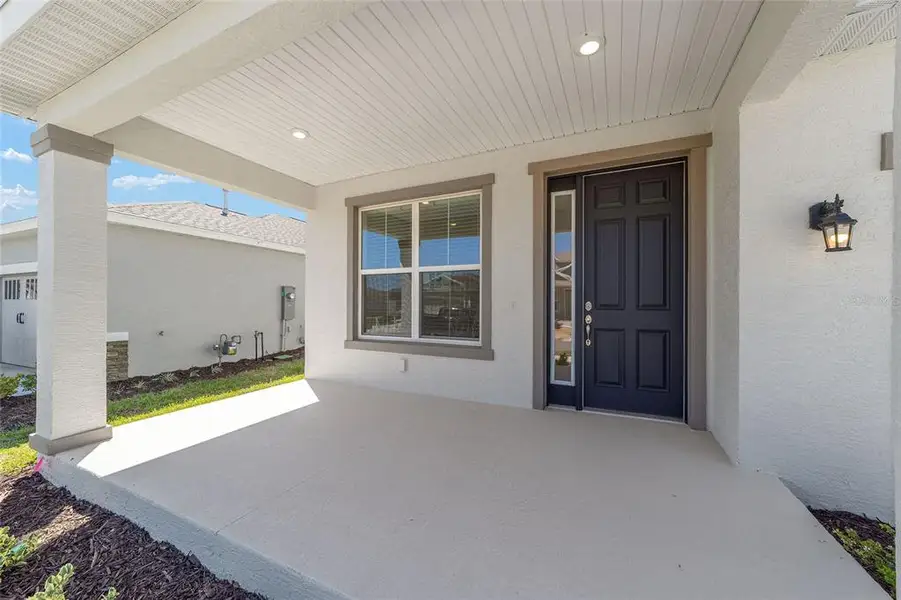 Exterior details and patio area of a home in Calesa Township, Ocala (Image 29).