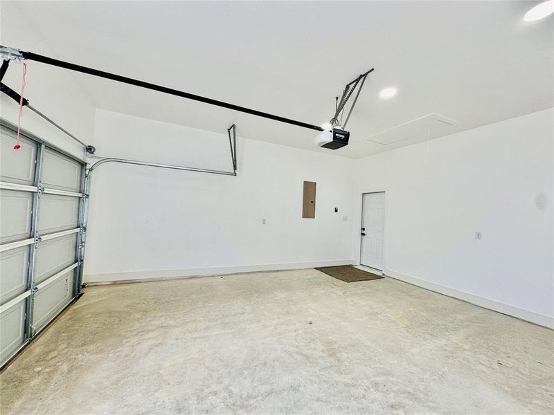 Garage with electric panel and a garage door opener Garage with electric panel and a garage door opener