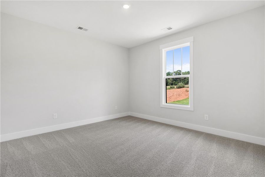 A well-lit, open interior space with fresh carpet A well-lit, open interior space with fresh carpet