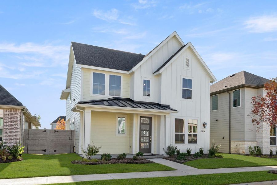 Front exterior of a new home in Carriage Collection at Painted Tree, McKinney, TX, highlighting curb appeal (Image 2).