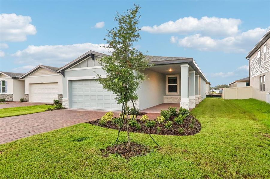 Front exterior of a new home in Villamar - Classic Series, Winter Haven, FL, highlighting curb appeal (Image 2). Front exterior of a new home in Villamar - Classic Series, Winter Haven, FL, highlighting curb appeal (Image 2).