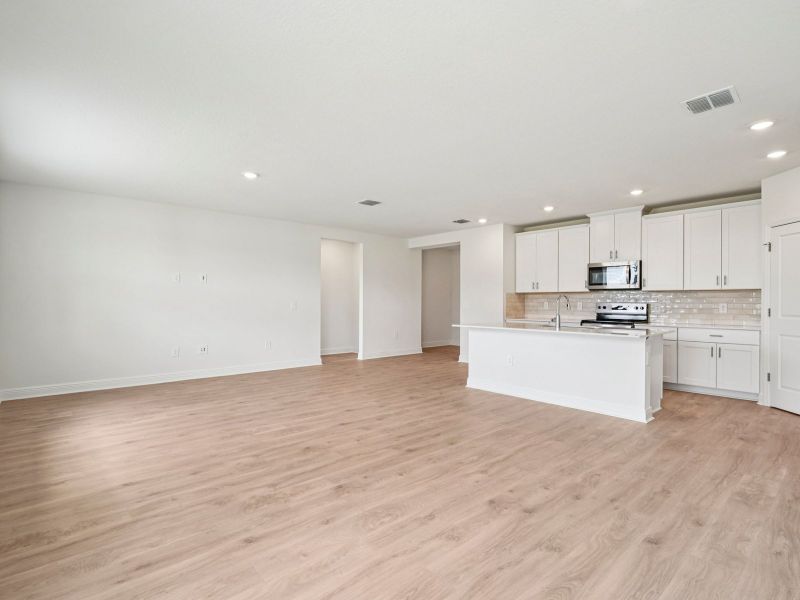 Spacious, unfurnished interior of a new home in The Reserve at Hammock Oaks - Signature Series, Lady Lake (Image 12).