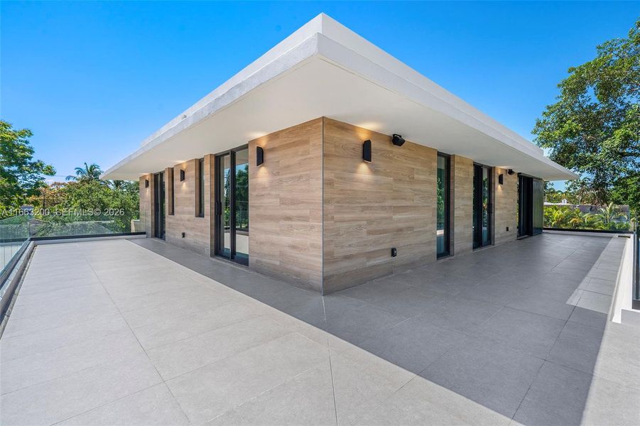 Exterior details and patio area of a home in , Miami Beach (Image 34). Exterior details and patio area of a home in , Miami Beach (Image 34).