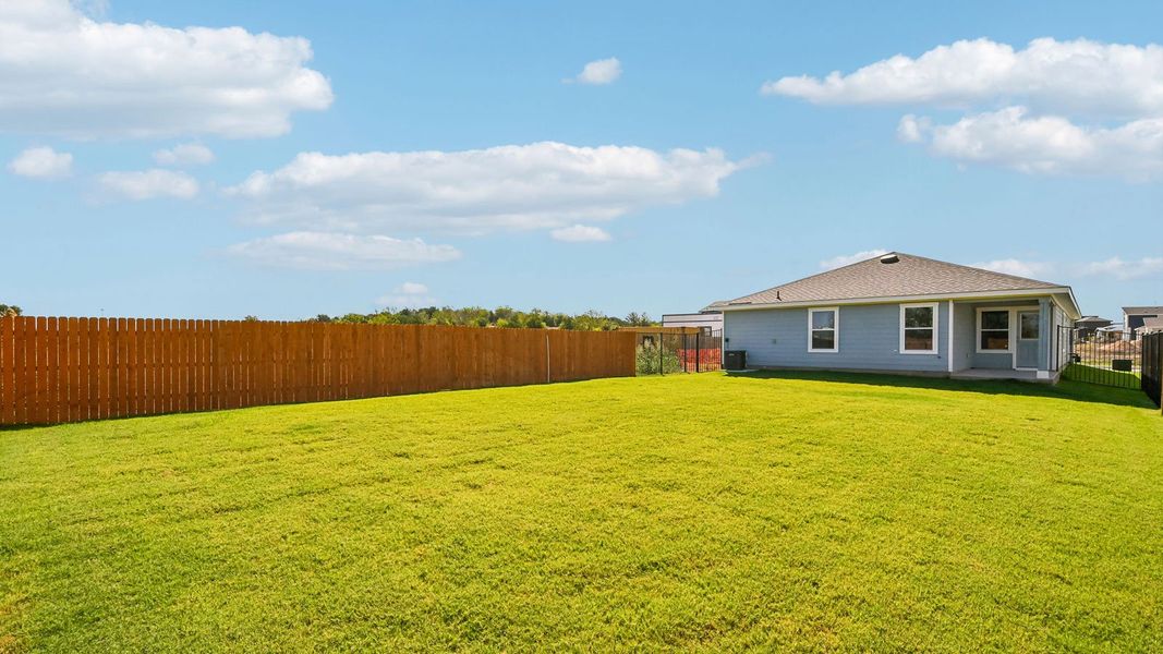 Exterior details and patio area of a home in Trails at Wildhorse, Austin (Image 4).